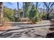 Circular driveway with mature trees and greenery, offering privacy and a serene setting for the property at 108 Tea Farm Rd, Summerville, SC 29483