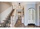 Elegant foyer featuring a staircase with patterned runner and unique stone flooring leading to an open floor plan at 108 Tea Farm Rd, Summerville, SC 29483