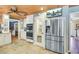 Bright kitchen with stainless steel fridge, tile floors, double ovens and white cabinets at 108 Tea Farm Rd, Summerville, SC 29483