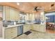 Bright kitchen with stainless steel appliances, tile backsplash, and cream colored cabinets at 108 Tea Farm Rd, Summerville, SC 29483