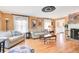 Bright and airy living room with fireplace, hardwood floors, neutral sofas, and charming decor at 108 Tea Farm Rd, Summerville, SC 29483
