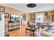 Cozy living room with hardwood floors, neutral paint, large TV, and traditional-style furnishings at 108 Tea Farm Rd, Summerville, SC 29483