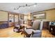 Living room with patterned chairs, a wet bar, hardwood floors, track lighting and fireplace at 108 Tea Farm Rd, Summerville, SC 29483