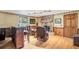 Living room with brick fireplace, patterned wallpaper, hardwood floors and bar with seating at 108 Tea Farm Rd, Summerville, SC 29483