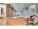 Cozy living room area with a brick accent wall and a built-in entertainment center at 108 Tea Farm Rd, Summerville, SC 29483