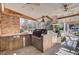 Covered outdoor kitchen with stainless steel appliances, sink and cooking area at 108 Tea Farm Rd, Summerville, SC 29483
