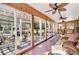 Inviting patio with ceiling fans, wood paneling, and view to garden and backyard at 108 Tea Farm Rd, Summerville, SC 29483