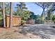 Property featuring wooden storage sheds with lush greenery, a long driveway for convenience at 108 Tea Farm Rd, Summerville, SC 29483
