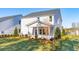Exterior view of a home with a manicured lawn, landscaping, and a covered porch, perfect for outdoor living at 116 Threaded Fern St, Summerville, SC 29485