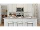 Stylish kitchen island with granite countertops and seating for three at 116 Threaded Fern St, Summerville, SC 29485