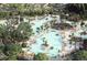 Resort-style pool complex featuring multiple pools, lounge areas, and lush landscaping for premier recreation at 116 Threaded Fern St, Summerville, SC 29485