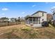 A cozy screened-in porch with a wood deck offers outdoor living space in the backyard at 12 Palmetto Park Dr, Charleston, SC 29407