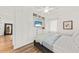 A bright bedroom featuring built-in storage, wood flooring, and a relaxing TV view at 12 Palmetto Park Dr, Charleston, SC 29407
