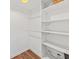 Spacious walk-in closet with built-in shelving, and wood flooring at 12 Palmetto Park Dr, Charleston, SC 29407