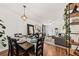 Open-concept dining room with seating for six and a view into the living area at 12 Palmetto Park Dr, Charleston, SC 29407