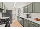Stylish kitchen with updated appliances, granite countertops, and modern cabinetry at 12 Palmetto Park Dr, Charleston, SC 29407