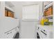 Convenient laundry room equipped with modern washer and dryer units and ample storage at 12 Palmetto Park Dr, Charleston, SC 29407
