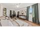 Spacious living room with a comfortable sofa, large windows, and hardwood floors at 12 Palmetto Park Dr, Charleston, SC 29407