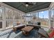 Screened-in porch with comfortable seating, offering an inviting outdoor space at 12 Palmetto Park Dr, Charleston, SC 29407