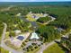 Stunning aerial view of the community with pool and lake at 1208 Red Buckeye Ct, Moncks Corner, SC 29461