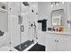 Modern bathroom features a walk-in shower with black fixtures and a sleek vanity at 1208 Red Buckeye Ct, Moncks Corner, SC 29461