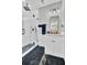 Modern bathroom features a walk-in shower with black fixtures and a sleek vanity at 1208 Red Buckeye Ct, Moncks Corner, SC 29461