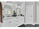 Bathroom featuring dual vanity with white cabinets and black hardware, and tile flooring at 1208 Red Buckeye Ct, Moncks Corner, SC 29461