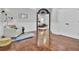 Bonus room with decorative wainscoting, hardwood floors, and access to a bedroom at 1208 Red Buckeye Ct, Moncks Corner, SC 29461