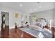 Expansive bedroom with hardwood floors, stylish seating, and large windows with lots of light at 1208 Red Buckeye Ct, Moncks Corner, SC 29461