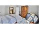 Spacious bedroom with wood cabinet, large rug, and ample natural light at 1208 Red Buckeye Ct, Moncks Corner, SC 29461
