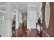 Elegant foyer with hardwood floors, detailed trim, and open access to dining room at 1208 Red Buckeye Ct, Moncks Corner, SC 29461