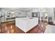 Spacious kitchen with a center island, modern appliances, and an open view into the living room at 1208 Red Buckeye Ct, Moncks Corner, SC 29461