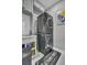 Efficient laundry area with stacked washer and dryer and ample storage at 1208 Red Buckeye Ct, Moncks Corner, SC 29461