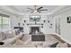 Inviting living room with fireplace, TV, and built-in shelving, providing ample storage space at 1208 Red Buckeye Ct, Moncks Corner, SC 29461