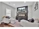 Living room with hardwood floors, large fireplace with mounted TV, sitting area and neutral color palette at 1208 Red Buckeye Ct, Moncks Corner, SC 29461