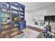 Office space featuring custom built-ins, hardwood floors, and natural light at 1208 Red Buckeye Ct, Moncks Corner, SC 29461
