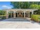 Outdoor pavilion with brick fireplace and ample seating for gatherings at 1208 Red Buckeye Ct, Moncks Corner, SC 29461