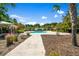 Community pool area featuring cabanas and landscaped walkways at 1208 Red Buckeye Ct, Moncks Corner, SC 29461