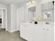 Bathroom featuring dual sinks, tile floors, and a large mirror with vanity lighting at 121 Loon Dr, Summerville, SC 29483