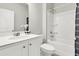 Bright bathroom featuring white cabinets, a shower, and a decorative flower at 121 Loon Dr, Summerville, SC 29483