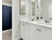Bathroom featuring dual sinks, modern fixtures, and a framed quote on the wall at 121 Loon Dr, Summerville, SC 29483