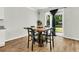 Bright dining area featuring a modern table and chairs, with a view of the backyard through sliding glass doors at 121 Loon Dr, Summerville, SC 29483