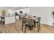 Dining area featuring a table with chairs, with bright white cabinets and stainless appliances in background at 121 Loon Dr, Summerville, SC 29483