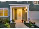 Charming front porch featuring manicured plants and modern door at 121 Loon Dr, Summerville, SC 29483
