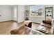 Bright living room features a large window, hardwood floors, and an elegant leather couch at 121 Loon Dr, Summerville, SC 29483