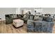 Cozy living room showcasing a large, comfortable sectional sofa with throw pillows and a matching ottoman at 121 Loon Dr, Summerville, SC 29483