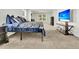Bright and airy main bedroom featuring neutral decor, carpet, and a TV at 121 Loon Dr, Summerville, SC 29483