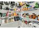Well-stocked pantry with ample shelving, filled with an array of food items and kitchen supplies at 121 Loon Dr, Summerville, SC 29483