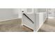 Carpeted stairwell with white trim and wooden handrail at 121 Loon Dr, Summerville, SC 29483