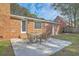 Backyard featuring a patio with outdoor furniture, a brick exterior, and a well-manicured lawn at 1247 Oakcrest Dr, Charleston, SC 29412